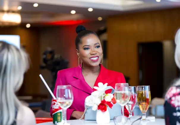 Qhawekazi Mdikane, Executive Head at Momentum Brand, chatting to other guests at a #SheOwnsHerSuccess event.