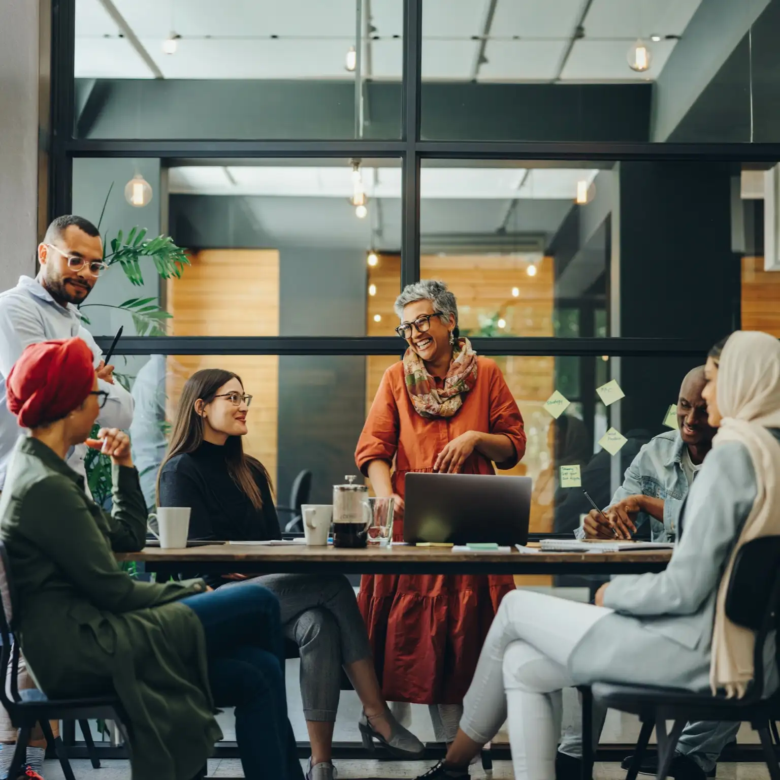 A group of employees collaborating around a table.