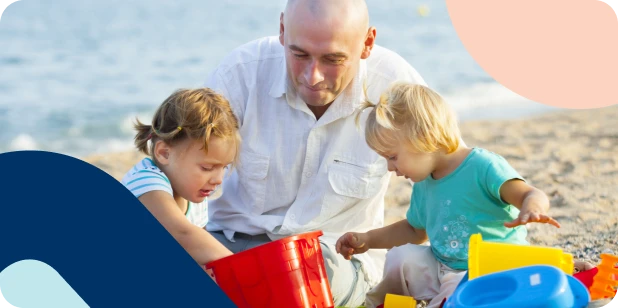 A man with his young children at the beach, knowing he’s left a secure legacy for his children.  