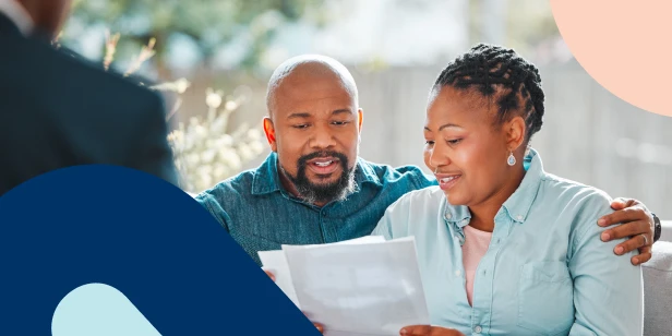 A couple reading the 'Momentum Financial Advice Research Report' together.