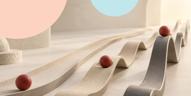 Abstract tracks ranging from a gentle, flat slope to steep, roller-coaster-like curves carrying red balls, illustrating the ups and downs and emotional impact of investing.