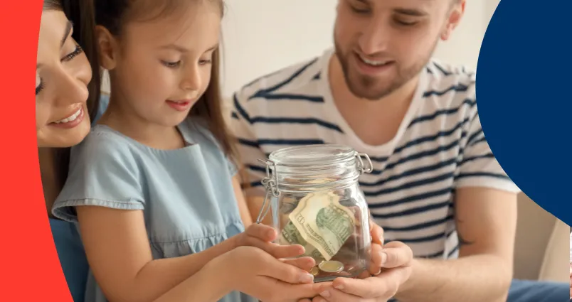 Parents on either side of their young daughter, looking inside a small savings kitty, teaching her the importance of early saving.