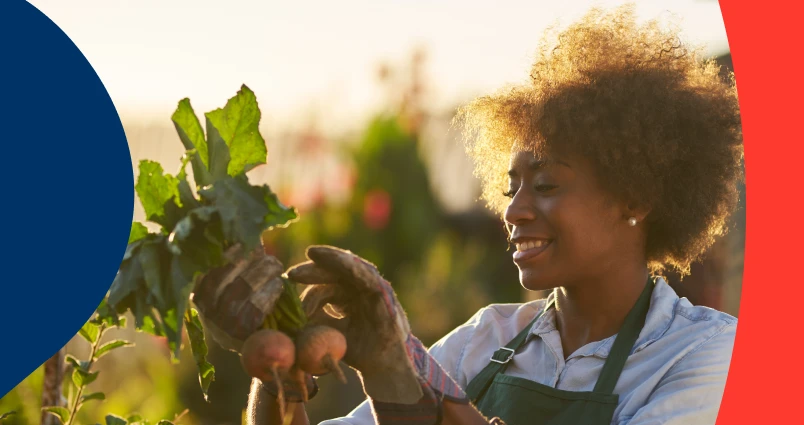 A woman gardening and nurturing her plants, representing retirement savings growth.