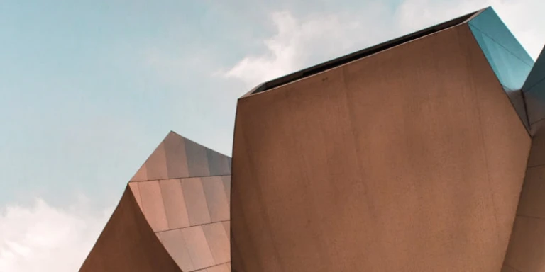 A split-image visual featuring an office interior, a city skyline, and pots of gold, symbolizing financial insights and future-proof finances. Accompanies a Momentum Corporate 2024 Insights Paper on evolving work trends and employee expectations.