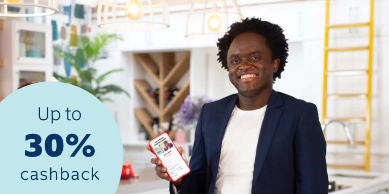 A man in the safety of his home, showcasing safety features such as Safety Alert which are available on the Momentum App.