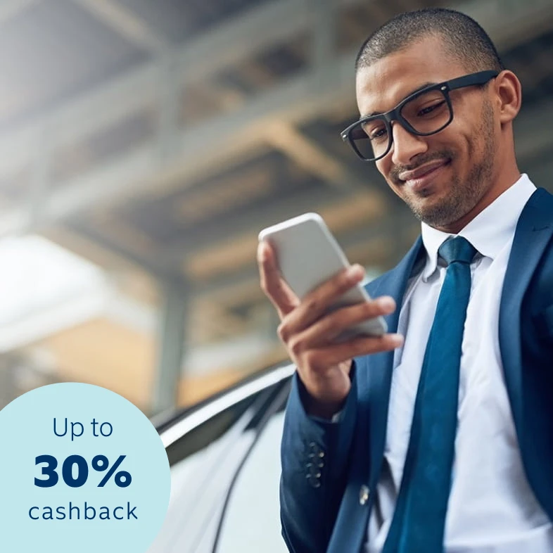 A man wearing specs getting a quote for Momentum Envoy car and home insurance.