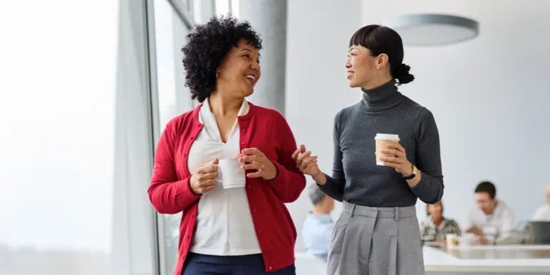 A Momentum Insure short-term insurance adviser with her client answering questions over coffee.