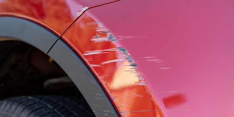 A family of 7 sitting in the boot of their SUV awaiting help from the responder as they used the Safety Alert feature that is free of charge for Momentum Insure policyholders.