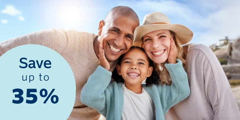 Happy couple on either side of their daughter smiling in a family portrait taken in the outdoors, confident that they’re protect as a family. Save up to 35% on monthly premiums with Momentum Life Insu