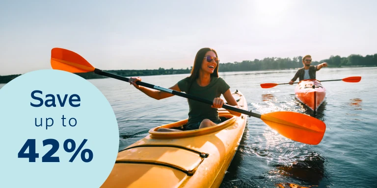 A young healthy family consisting of a couple, a son and a daughter enjoying the outdoors. Save up to 42% with Momentum Medical Scheme.