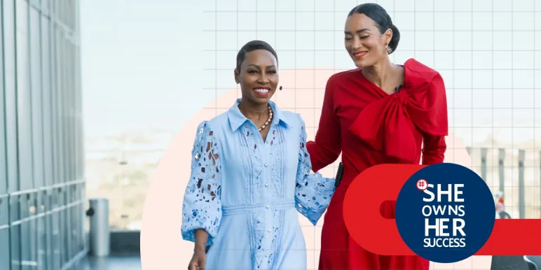 South African woman trailblazers Elana Afrika and Jo-Ann Strauss arrive at the 2026 Momentum #SheOwnsHerSuccess event in glamorous red and pastel blue dresses.