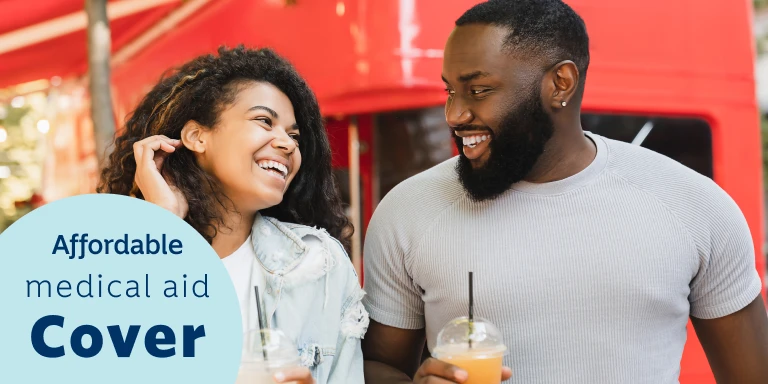 A young female and male holding smoothies chatting about the Ingwe Option from Momentum Medical Scheme that's suitable for first time earners and students.