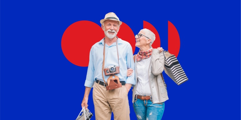 A happy elderly white couple walking hand-in-arm on a holiday they saved up for.