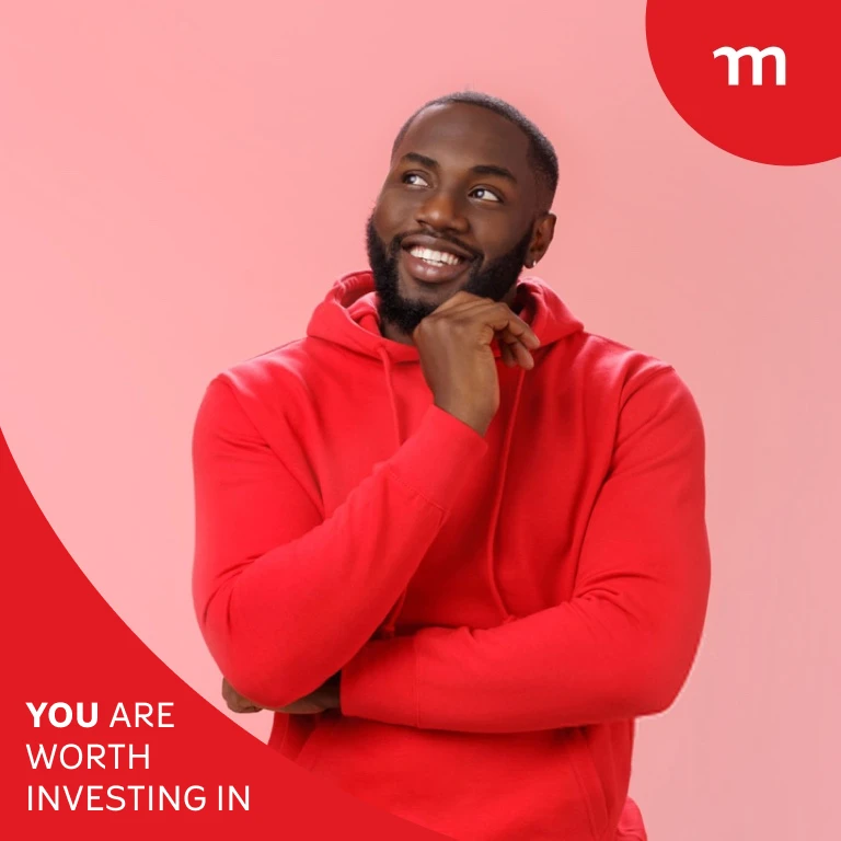 Young black man in a red sweater posing with his hand on his chin.