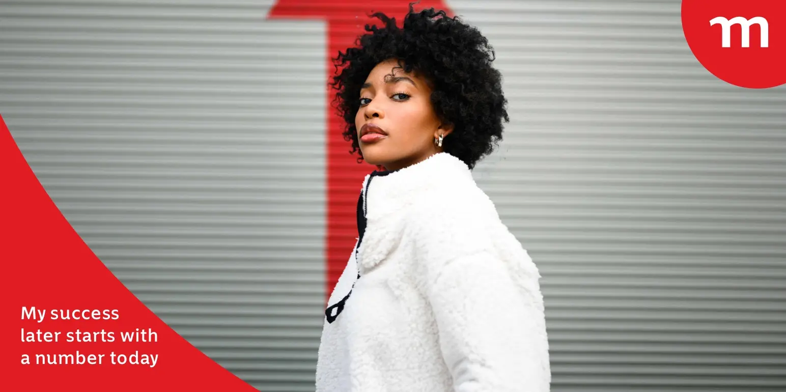 Young woman standing in front of a large red upward arrow symbolising compound interest and growth, representing smart retirement planning with a retirement annuity.